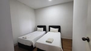 Postel nebo postele na pokoji v ubytování Roxy Hotel & Apartments