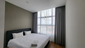 Postel nebo postele na pokoji v ubytování Roxy Hotel & Apartments