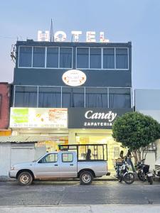 a truck parked in front of a building at Hotel Sicarú in Salina Cruz