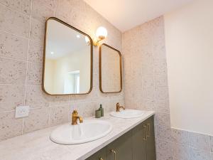 a bathroom with two sinks and a large mirror at Maison rénovée au cœur du Parc naturel de la Brenne, charme authentique - FR-1-591-734 in Pouligny-Saint-Pierre +15 photos