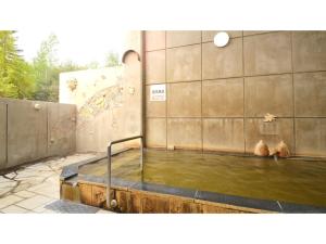 a pool of water next to a wall with a pool of water at Hotel Hounomai Otofuke - Vacation STAY 29492v in Otofuke