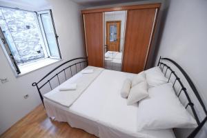 Posteľ alebo postele v izbe v ubytovaní Apartment Duje