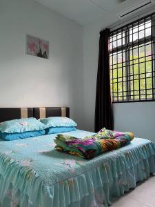 a bedroom with two beds and a window at AziziYati Muslem Homestay KLIA Sepang - SemiD House in Sepang