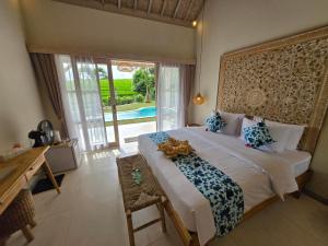Postel nebo postele na pokoji v ubytování United Colors of Bali Nature