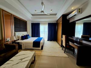 a hotel room with a bed and a piano at Luxury Sea View Apartments in Negombo +93 photos