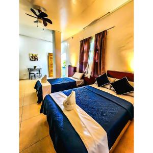 Letto o letti in una camera di ZHANG RESORT and DIVE CENTER
