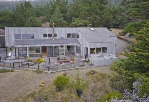 an aerial view of a large house with a garden at Indigo Tide, True Ocean Bluff at Sea Ranch in Sea Ranch