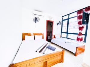 En eller flere senge i et værelse på Anh Thuận Cát Bà Hotel