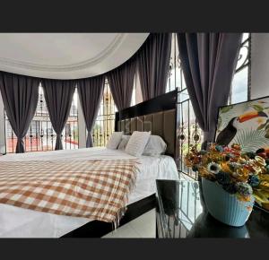 a bedroom with a bed and a large window at EDS Senior Citizen Care Centre in Cheras
