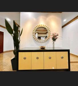 a dresser with a mirror in a room at EDS Senior Citizen Care Centre in Cheras