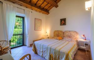 a bedroom with a bed and a large window at Amazing Home In Montemarciano With Wifi in Alta Marina