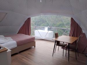 Voodi või voodid majutusasutuse Glamping Machakhela 2 toas