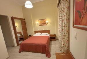 Posteľ alebo postele v izbe v ubytovaní Hotel Kronio