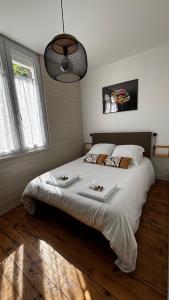 Ένα ή περισσότερα κρεβάτια σε δωμάτιο στο Superbe duplex climatisé avec jardin classé 3 étoiles 2 à 4 pers