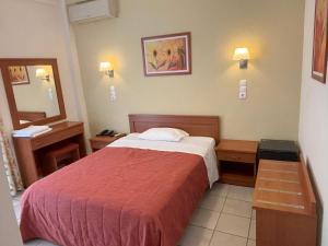 Postel nebo postele na pokoji v ubytování Hotel Kronio