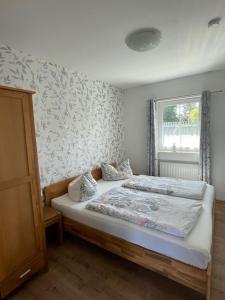 Ένα ή περισσότερα κρεβάτια σε δωμάτιο στο Ferienhaus Kaptein Meyer