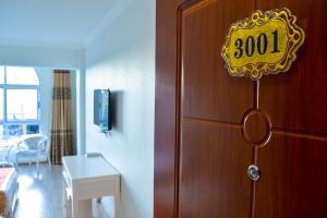 TV a/nebo společenská místnost v ubytování Wuduria Hotel