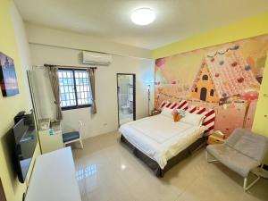 TV a/nebo společenská místnost v ubytování 澎湖藍海會館Blue Ocean Inn Penghu