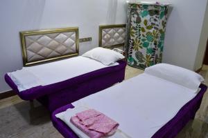 Postel nebo postele na pokoji v ubytování Wuduria Hotel