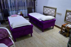 Postel nebo postele na pokoji v ubytování Wuduria Hotel