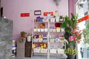 a shelf with baskets of food in a store at Ir Inn Hotel in Skudai