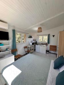 a living room with a couch and a table at Kallinera in Porto-Vecchio
