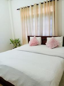 Postel nebo postele na pokoji v ubytování Villa Ayaavi Weligama