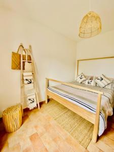 a bedroom with a bed and a ladder in it at Baia dell Alba in Termoli
