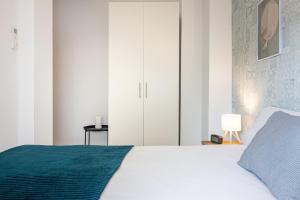 Posteľ alebo postele v izbe v ubytovaní Sea & Wave Nuño Apartment