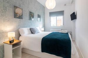 Posteľ alebo postele v izbe v ubytovaní Sea & Wave Nuño Apartment
