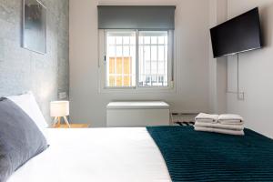 Posteľ alebo postele v izbe v ubytovaní Sea & Wave Nuño Apartment
