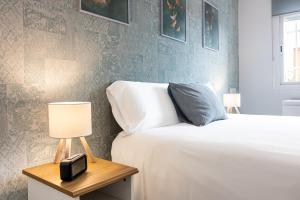 Posteľ alebo postele v izbe v ubytovaní Sea & Wave Nuño Apartment