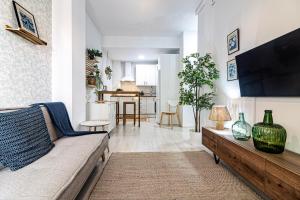 Televízia a/alebo spoločenská miestnosť v ubytovaní Sea & Wave Nuño Apartment