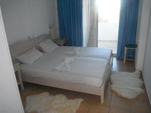 Postel nebo postele na pokoji v ubytování Mandorla Apartments