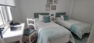 Кровать или кровати в номере Apartamento Illa Salvora, Portonovo