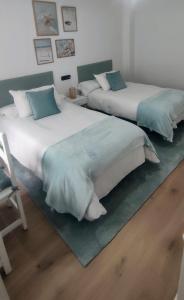 Кровать или кровати в номере Apartamento Illa Salvora, Portonovo