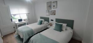 Кровать или кровати в номере Apartamento Illa Salvora, Portonovo