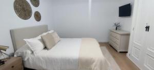 Кровать или кровати в номере Apartamento Illa Salvora, Portonovo