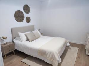 Кровать или кровати в номере Apartamento Illa Salvora, Portonovo