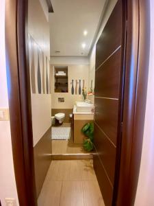 a bathroom with a toilet and a sink at Villa Moné in Koskinou +23 photos