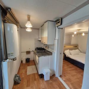 a small apartment with a kitchen and a bed at JTN House for daily rent in Seoul Oktabang in Seoul