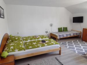 Postel nebo postele na pokoji v ubytování Villa LIKE "garden-grill"