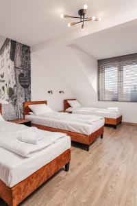 Ένα ή περισσότερα κρεβάτια σε δωμάτιο στο Aparts & Hotel Garbarska