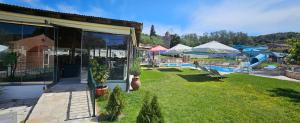 The swimming pool at or close to Pension Nychterida