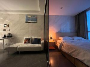 a bedroom with a bed and a chair in it at Seoul Modern Cozy Stay in Seoul