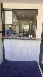 a view of a kitchen with a counter top at Enseada formosa in Cabedelo
