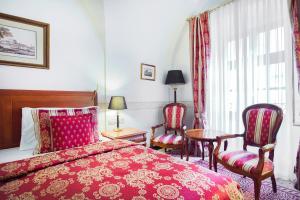 Postel nebo postele na pokoji v ubytování Arcadia Boutique Hotel