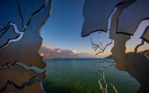a view of a body of water through a painting at La petite Venise des Alpes, Ultra centre 1 à 5 Pers in Annecy