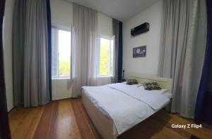 Postel nebo postele na pokoji v ubytování Iveri House
