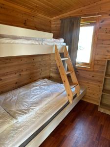 Postel nebo postele na pokoji v ubytování Fjordcamp